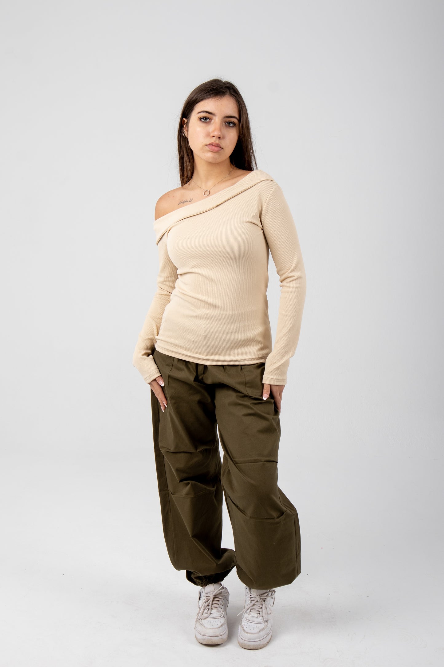 Off shoulder top in beige.