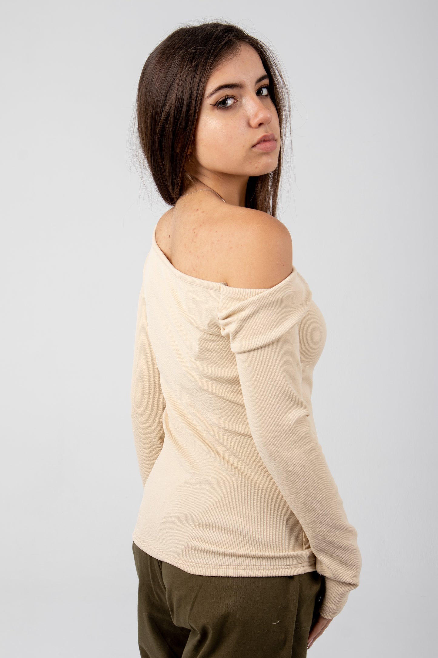 Off shoulder top in beige.