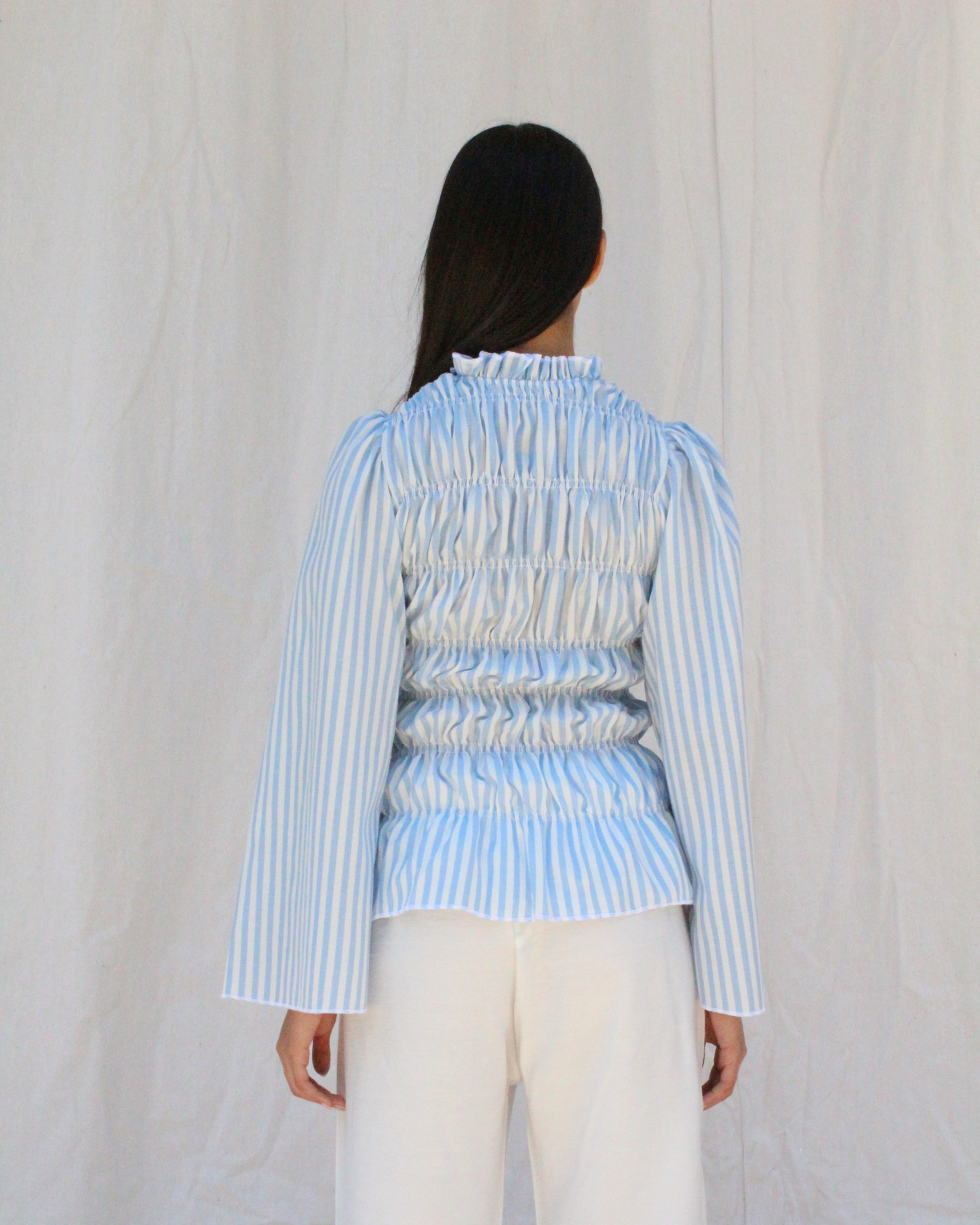 Smocked long sleeve top in blue