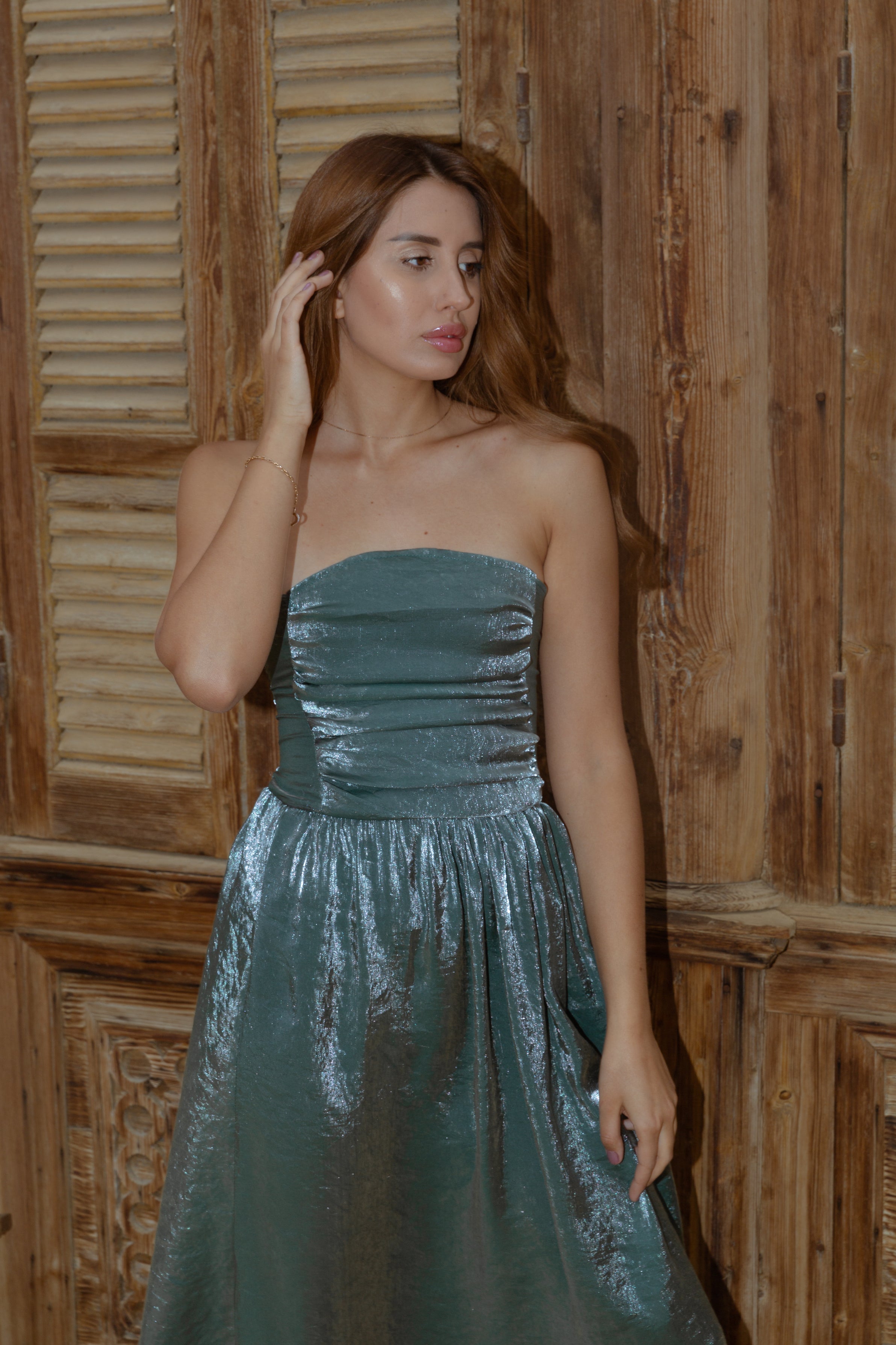 Flatter dress in shimmery green